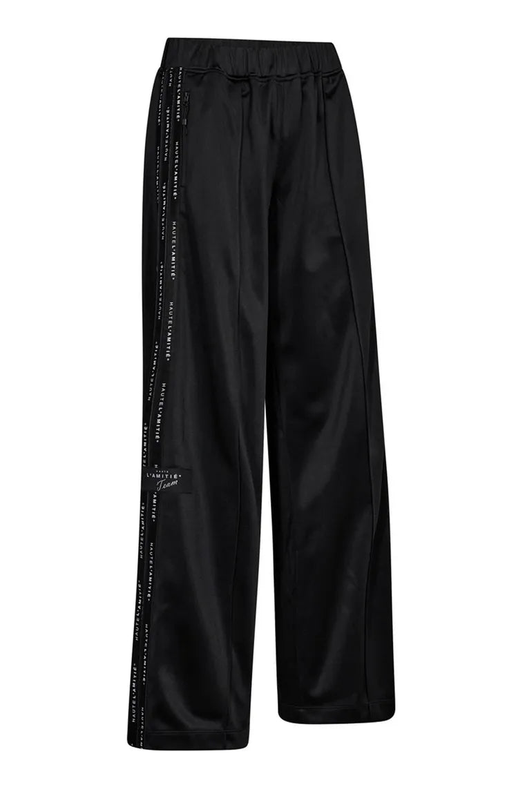 HAUTE L'AMITIÉ - Logo Tape Track Tall Pant